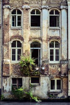 Old weathered wall with vintage windows, Gent, Belgium