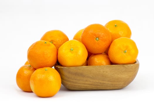 tangerines in a bowl on white background