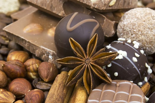 background with chocolate, coffee, spices and nuts
