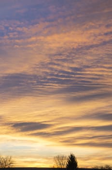 Beautiful sunrise sky with golden clouds