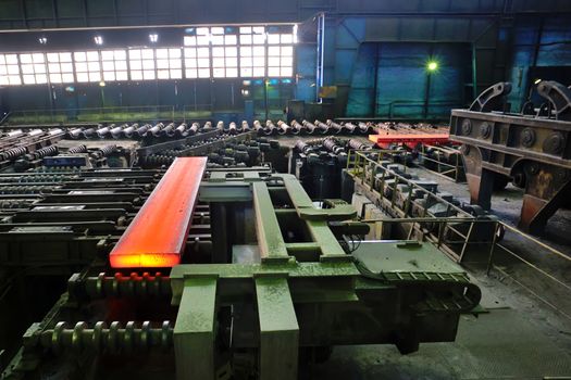 hot steel plate on conveyor inside of steel plant