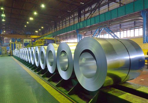 packed coils of steel sheet inside of plant