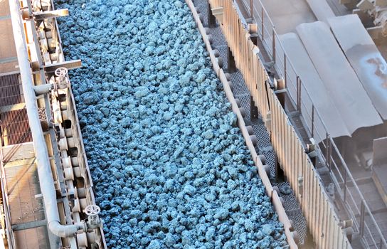 hot ore on conveyor inside of plant