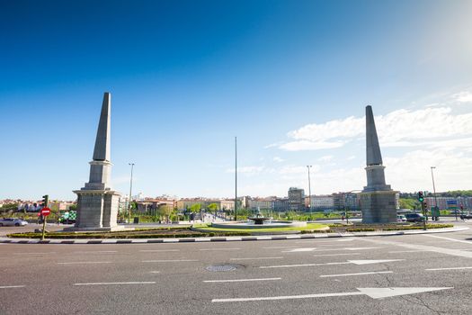 Madrid, Spain - May 5, 2012: Roundabout of the Pyramids ("Glorieta de las Pirámides") in front of Toledo Bridge on a sunny spring day, Madrid, Spain. It was built in XVII century.
