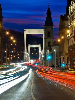 Traffic on the bridge at night in Budapest, Hungary