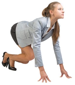 Businesswoman standing in running start pose, half-turn. Isolated over white background