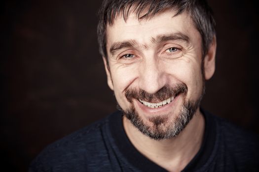 Portrait of smiling man in white