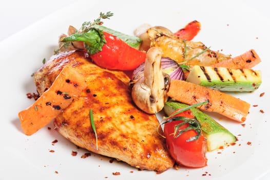 grilled chicken fillet and big pieces of vegetables