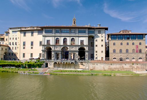 Photo shows a general view onto the city river bank with its houses.