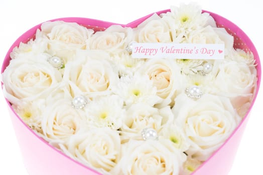 White roses and pearl and diamond held in the heart shape box with "happy valentine's day" text label. gift for valentine 's day, isolated on white background