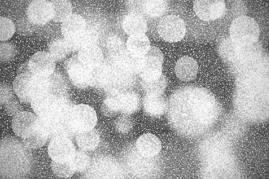 Pointillized black and white bokeh abstract background.