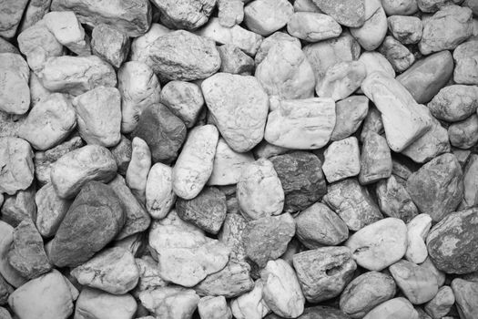 close-up small rock texture on the ground, background, black and white