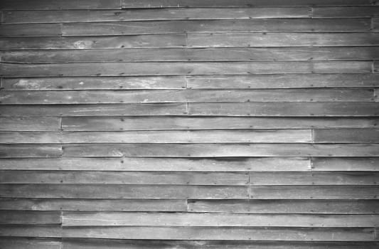 close up of wall made of wooden planks, vignette, black and white