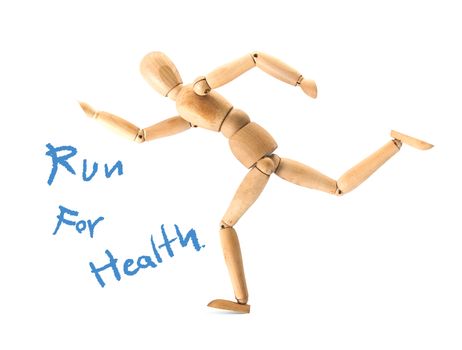 Wooden figure on running pose isolated on white,running for health concept