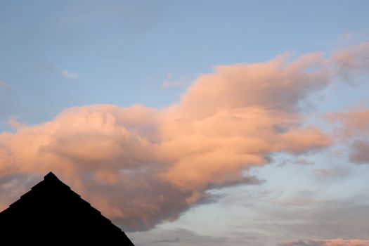 silhouette of a rooftop with a beautiful red sky in the background