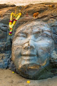 closeup facial image of Shiva on the beach