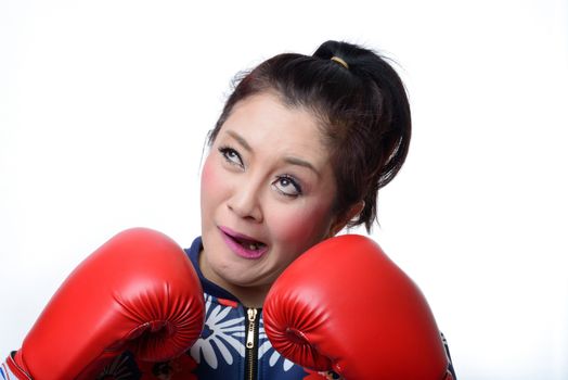 squint eyed crazy woman in boxing gloves isolated on white