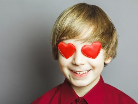 Portrait of a boy with hearts on face