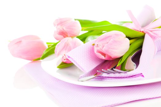 pink tulips in a plate, on a white background. romantic still life with fresh flowers