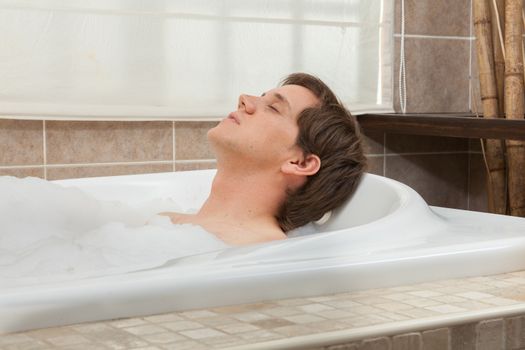 Man relaxed in the tub