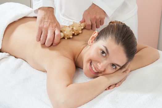 Happy woman getting a massage and smiling