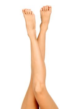 Long female legs on a white background, isolated, copyspace