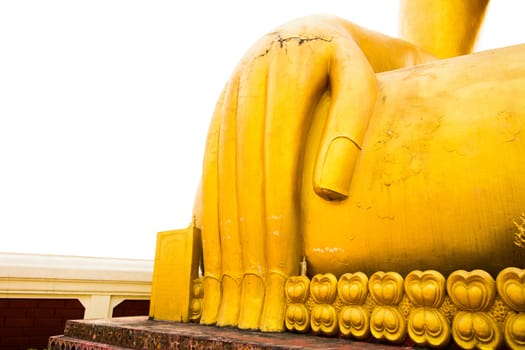 Hand of golden ancient Buddha image in thailand, isolated on white background.