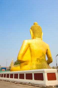 back of big golden buddha statue in thai temple.