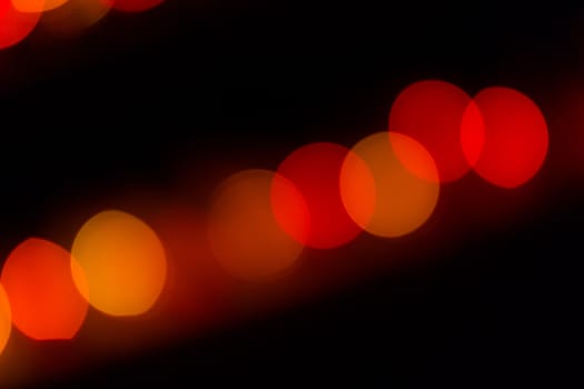 Abstract red and orange circular lined bokeh background of Christmas light