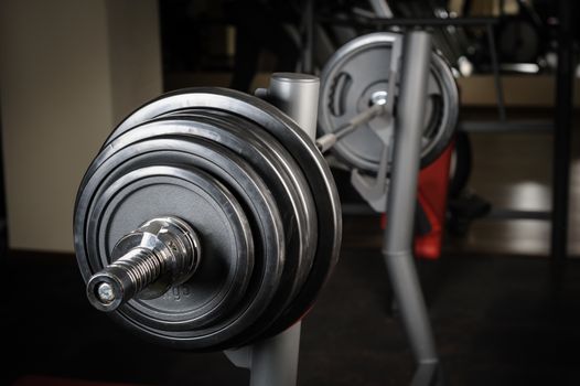 Barbell ready to workout, indooors, shallow DOF