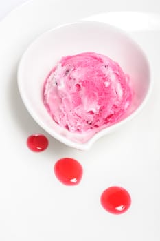 Strawberry pink ice cream ball in bowl on white background