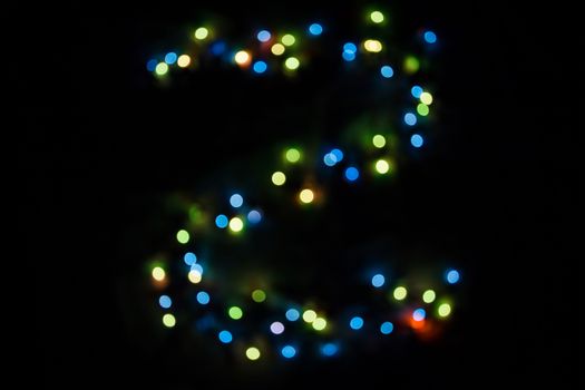 defocused colorful letter Z made of blurred circular bokeh on black background