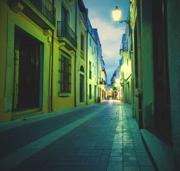 Tossa de Mar, Catalonia, Spain, 18.06.2013, old town street lights illuminated at night, the image of instagram style