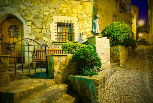 Tossa de Mar, Catalonia, Spain, 2013.06.18, Night old street in the ancient town of medieval fortress Vila Vella, Instagram image style. Editorial use only