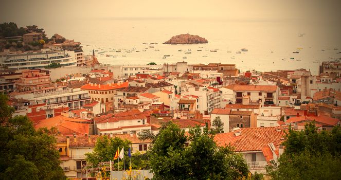 Tossa de Mar, Catalonia, Spain, 2013.06.18, the panorama of the town from the top of the mountain on a cloudy day, instagram image style, editorial use only