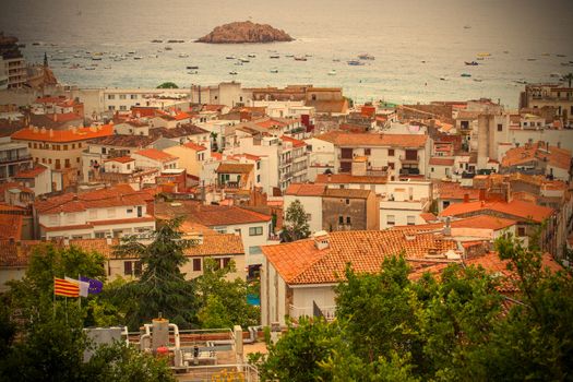 Tossa de Mar, Catalonia, Spain, 2013.06.18, the panorama of the town from the top of the mountain on a cloudy day, instagram image style, editorial use only