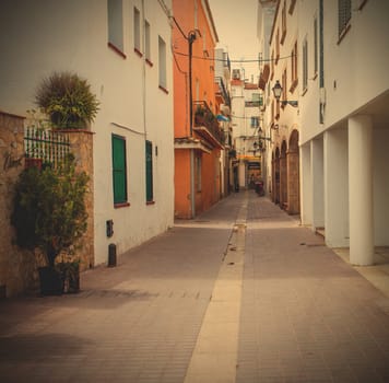 Tossa de Mar, Spain, JUNE 20, 2013: ancient street at summer day. Instagram image style