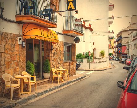 Spain, Catalonia - JUNE 20, 2013: Carrer Giverola street in the Tossa de Mar town. Instagram image style