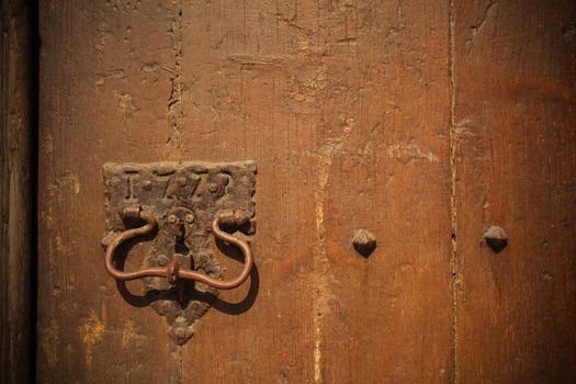 fragment of ancient door with handle, Spain, in 1773, instagram filter style