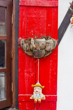 Coir pots on red pole