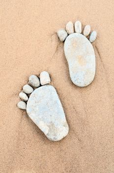 Stone footprints in the sand
