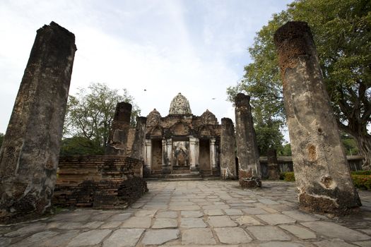 Buddha Statue in Wat Mahathat Temple in Sukhothai Historical park at sunrise, Thailand