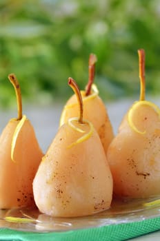 four pears poached in syrup