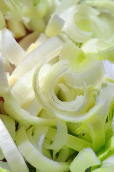Fresh leek sliced close-up in vertical format