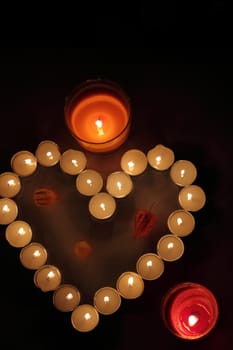 Heart of candles, a sign of love. romantic evening