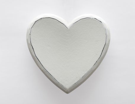 white wooden heart on white