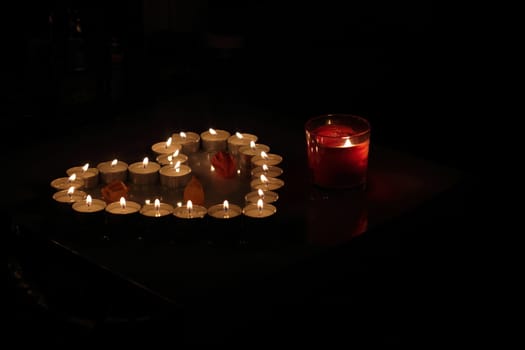 Heart of candles, a sign of love. romantic evening