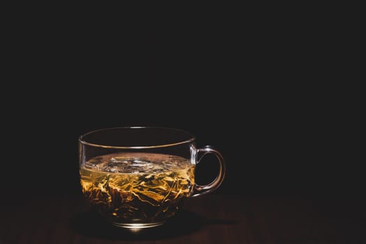 Green tea on a dark background.