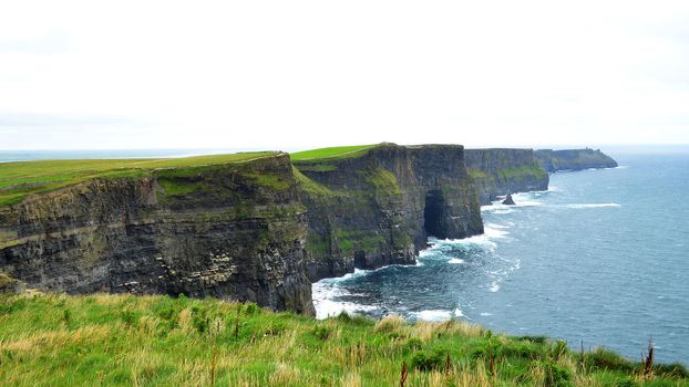 The Cliffs of Moher are located in County Clare, Ireland. They rise 120 metres (390 ft) above the Atlantic Ocean.