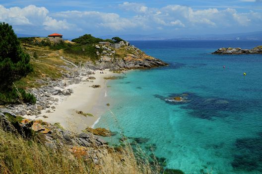 Nosa Señora beacj is a little beach with white sand and turquoise water on Cíes Islands (Atlantic Islands of Galicia National Park).